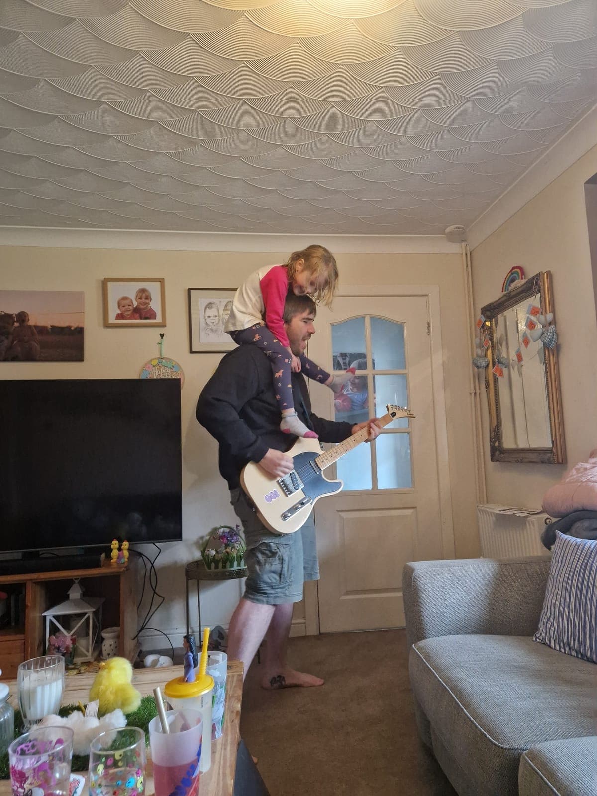 Dave Langdon practising guitar between East Anglia retailer visits — wholesale greeting card and gift sales agent Suffolk